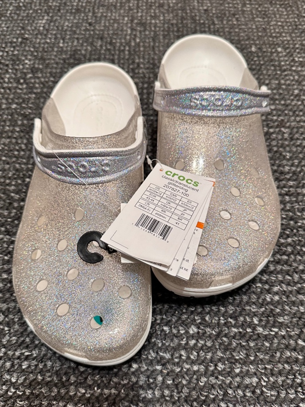 These are Crocs Classic Translucent Glitter Clogs in white, featuring a transpar